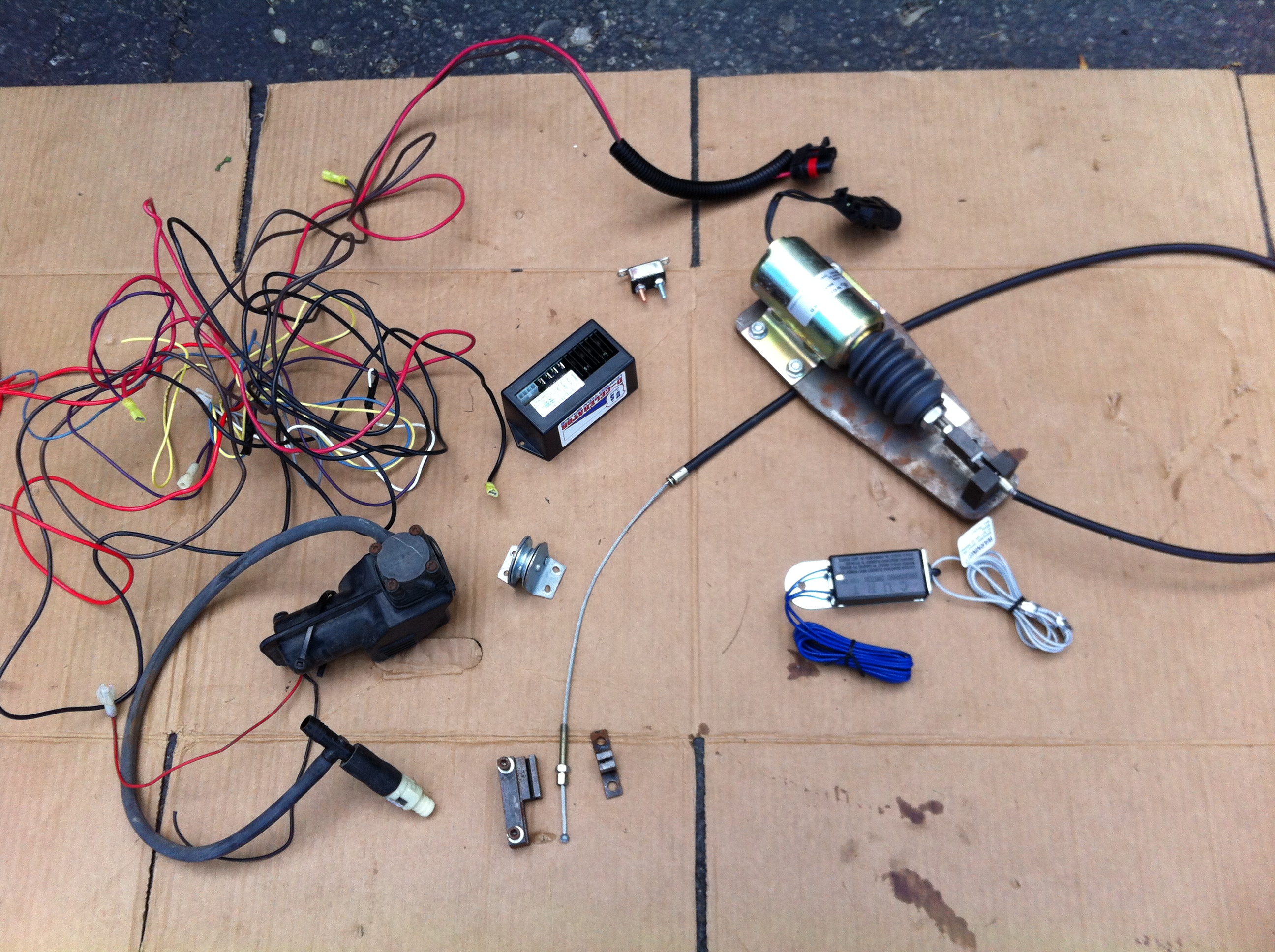 ... electric actuator solenoid with flexible cable, break-away switch, brake pedal clamp, vacuum pump with check valve, wiring harness, and brake cable ...